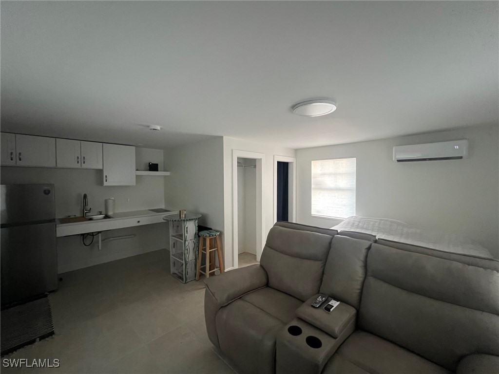 11458 May Street, Unit 1 Matlacha, FL 33993 - Photo 6 of 18 a living room with stainless steel appliances furniture and a window