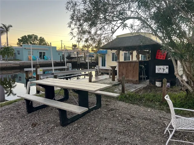 a view of a lake with boats and trees in the background