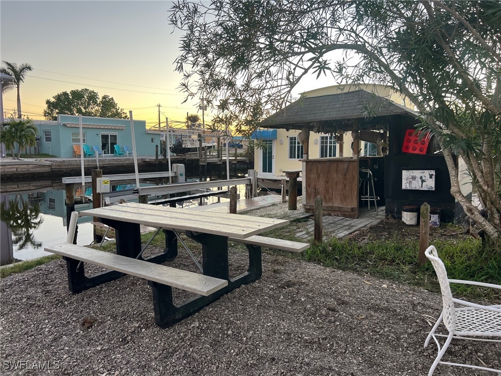 11458 May Street, Unit 1 Matlacha, FL 33993 - Photo 9 of 18 a view of a house with backyard and sitting area