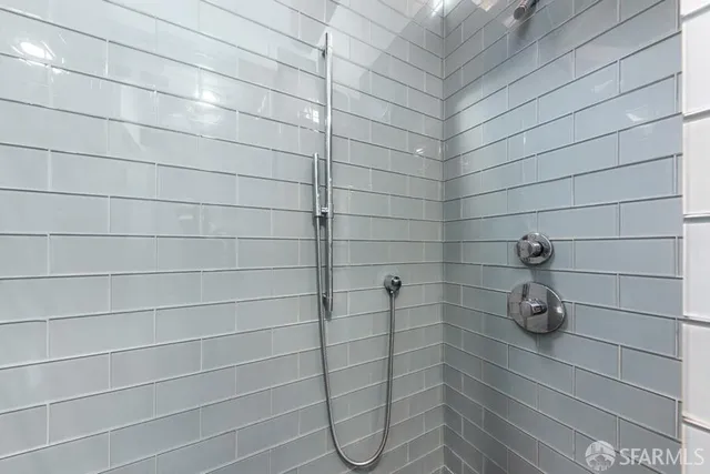 a living room with furniture a table and large windows