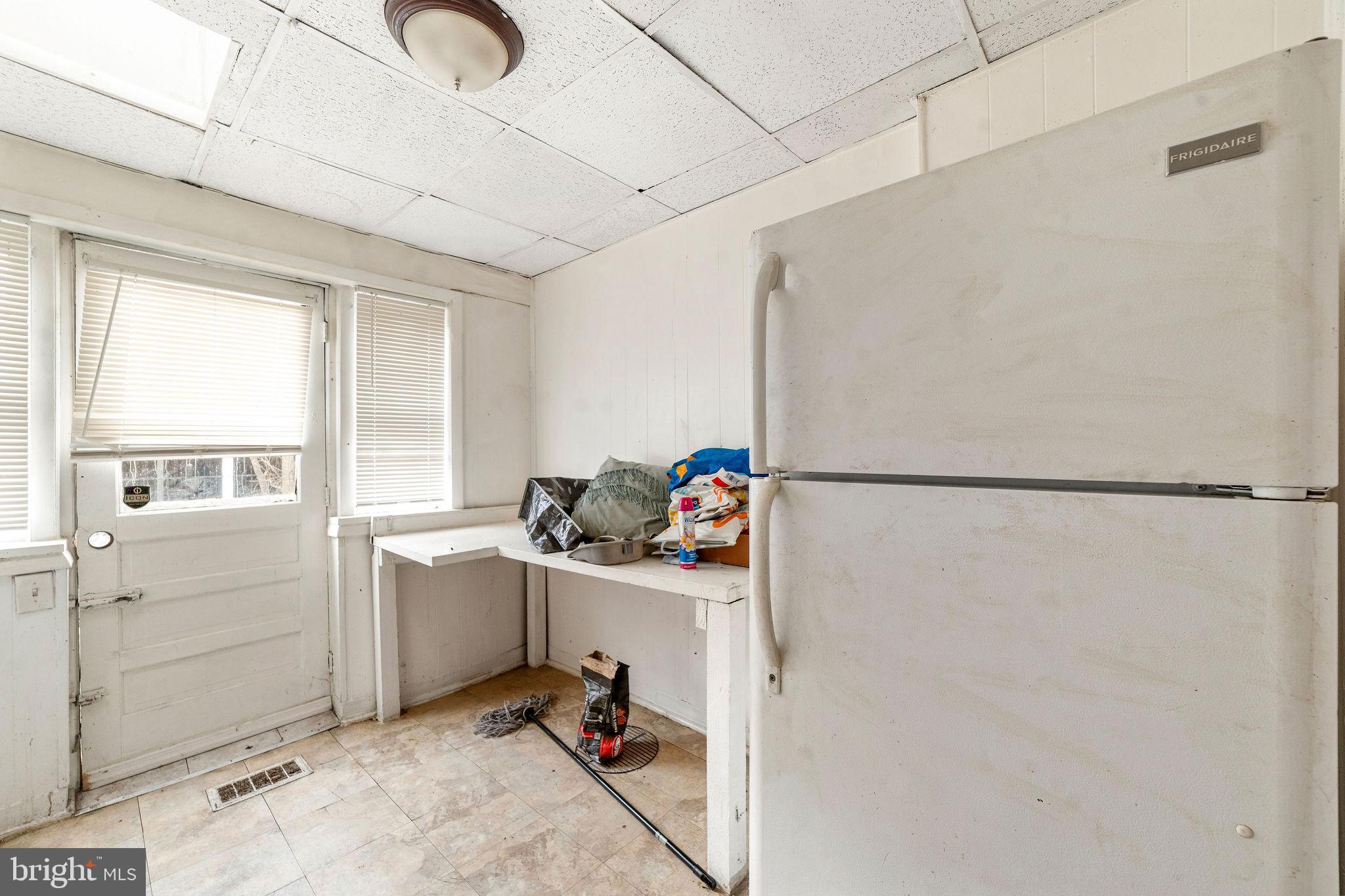 1263 South Merrimac Road Camden, NJ 08104 - Photo 12 of 21 a view of a storage & utility room with a window