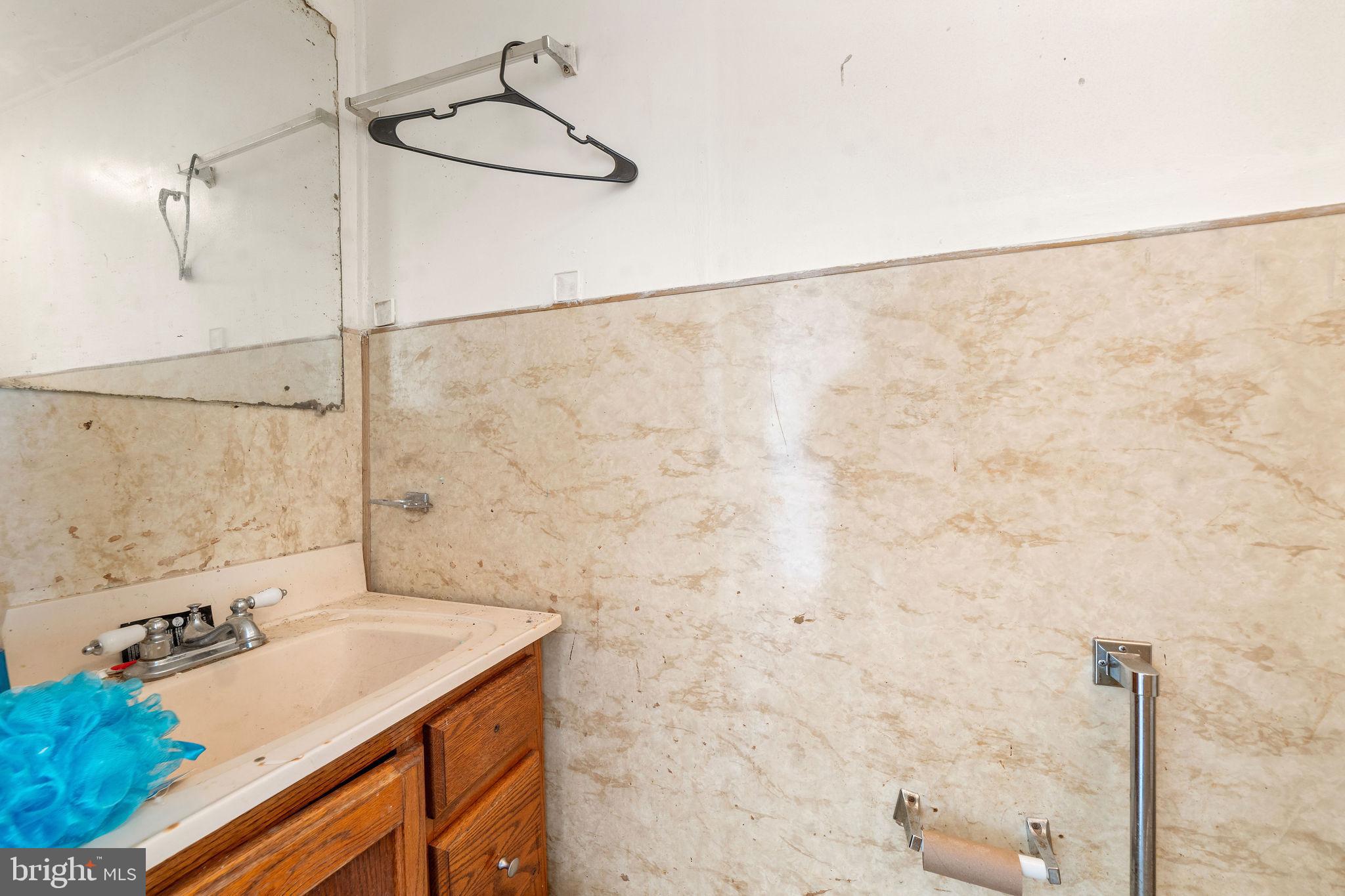 1263 South Merrimac Road Camden, NJ 08104 - Photo 14 of 21 a bathroom with a sink and a shower