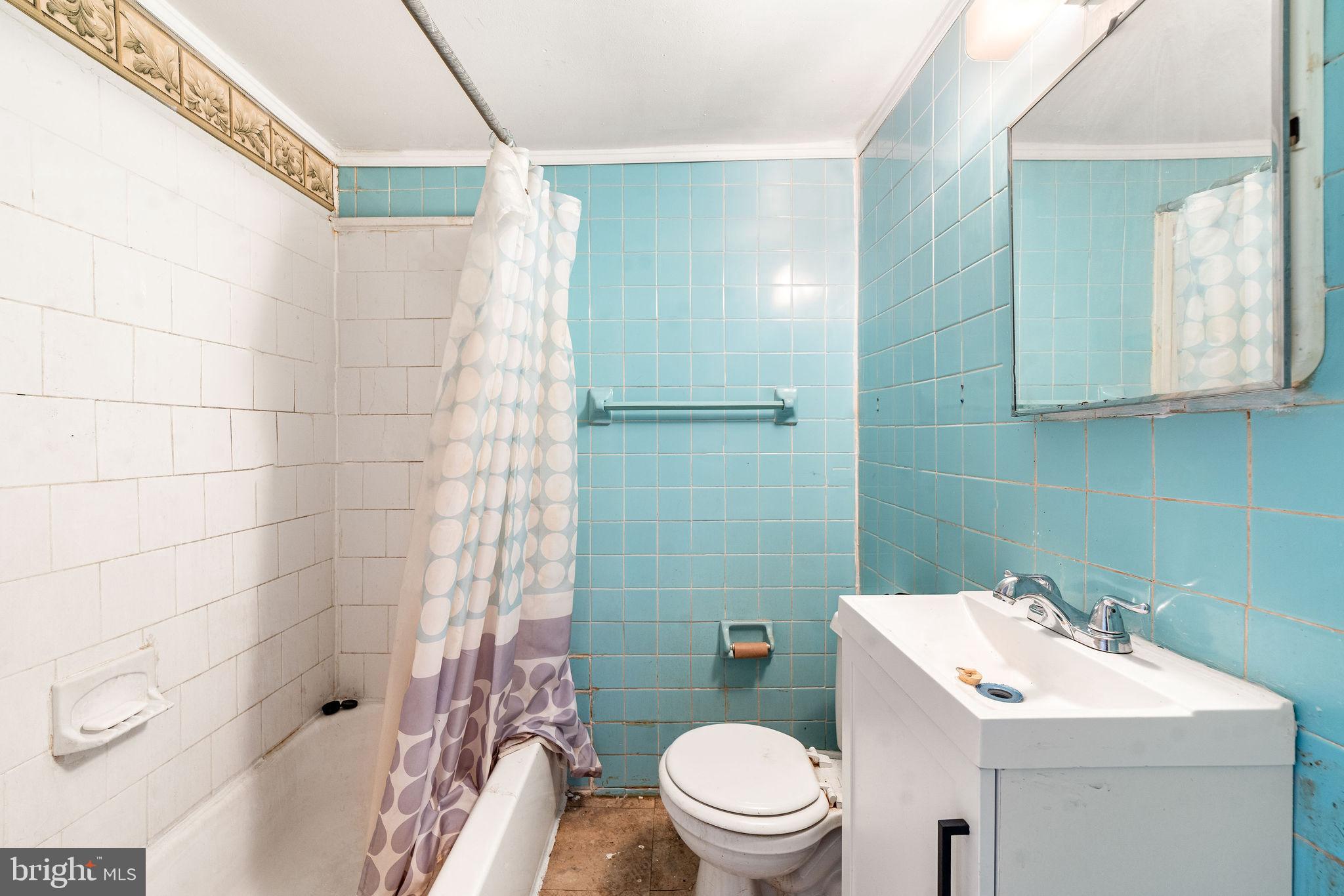 1263 South Merrimac Road Camden, NJ 08104 - Photo 19 of 21 a bathroom with a sink toilet and shower