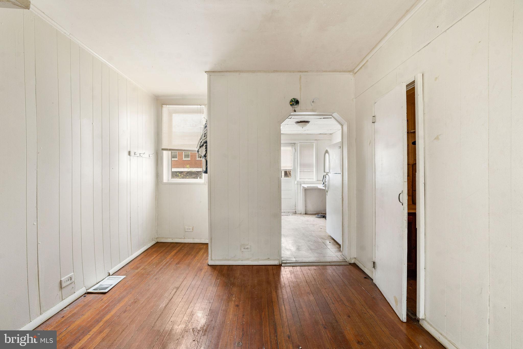 1263 South Merrimac Road Camden, NJ 08104 - Photo 9 of 21 a view of a hallway with wooden floor