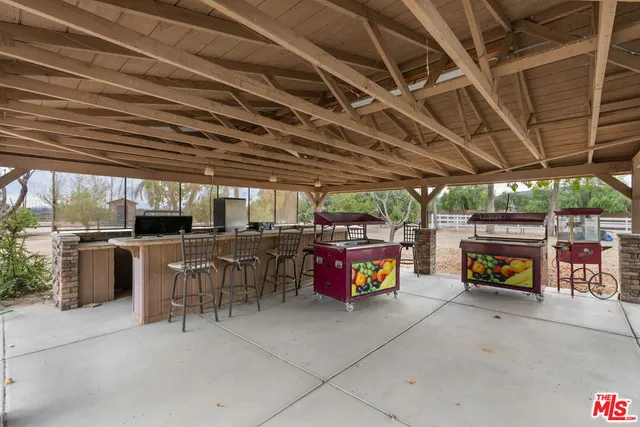 a view of a garage with a table and chairs