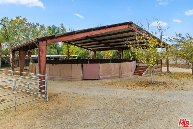 a backyard of a house with a shaded area