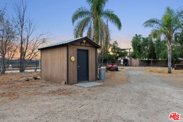 a view of a house with a yard covered in snow