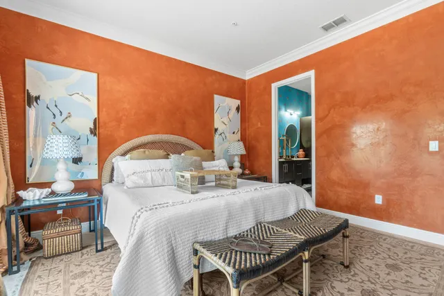 a bedroom with a bed and a table