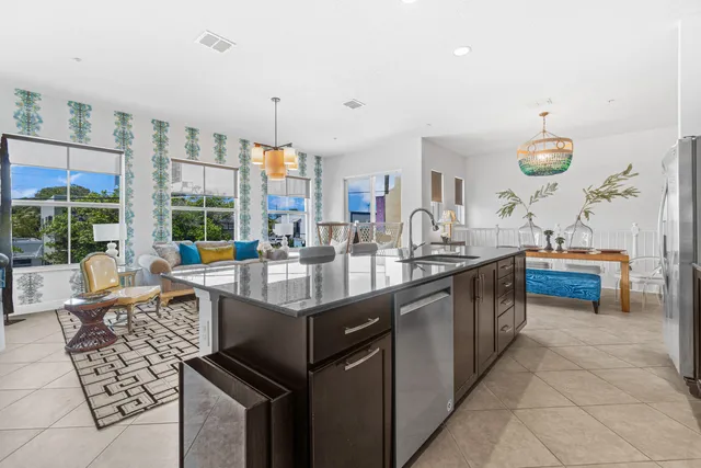 a kitchen with granite countertop a sink and a stove