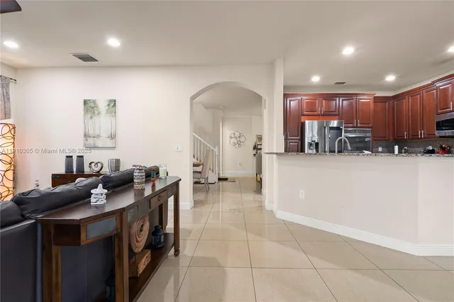 a bathroom with a sink and mirror with toilet