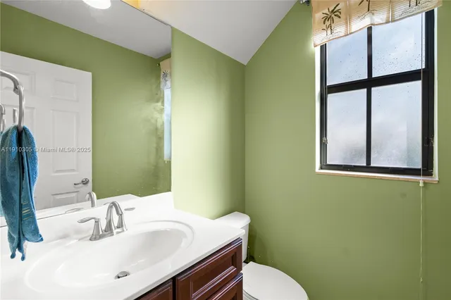 a bedroom with bed and window