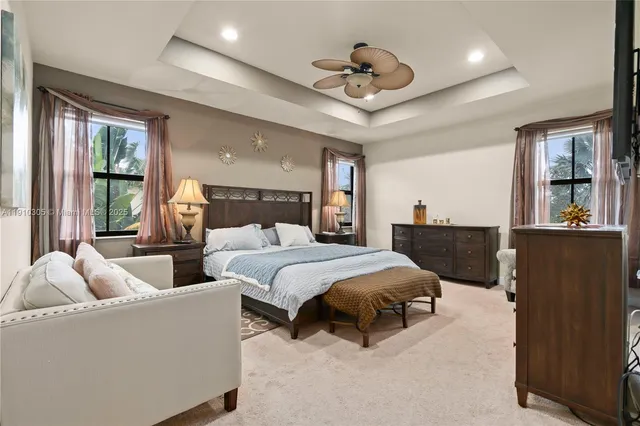 a bathroom with a granite countertop sink mirror and shower
