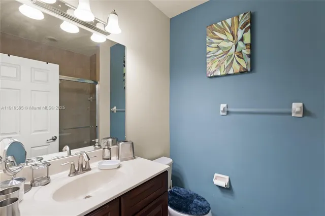 a bed room with a bed and a television