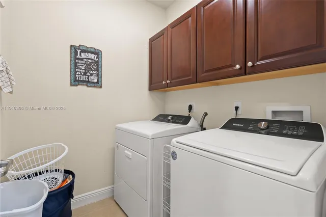 an aerial view of residential houses with outdoor space and river