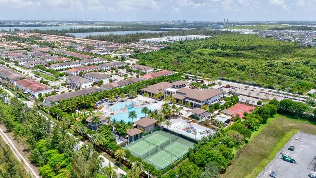 a view of a swimming pool with a yard