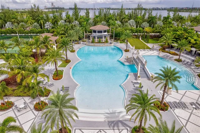 a bedroom with furniture and a flat screen tv