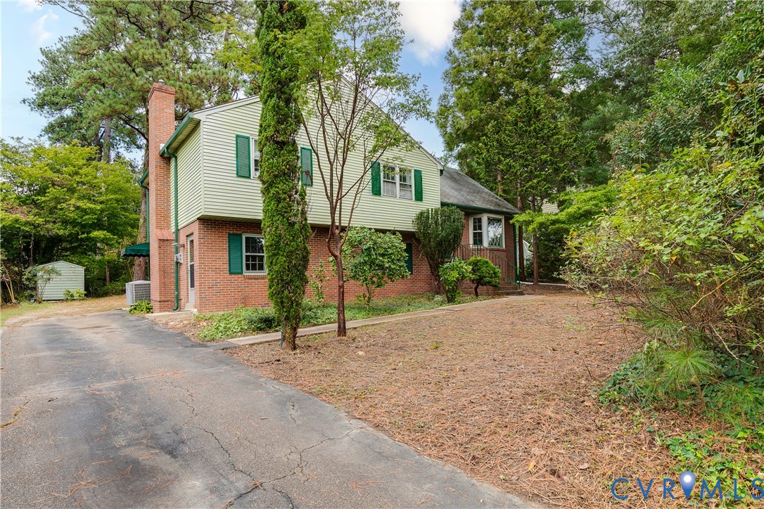 7402 Three Chopt Road Richmond, VA 23226 - Photo 2 of 25 Tucked behind several trees and bushes, you will f