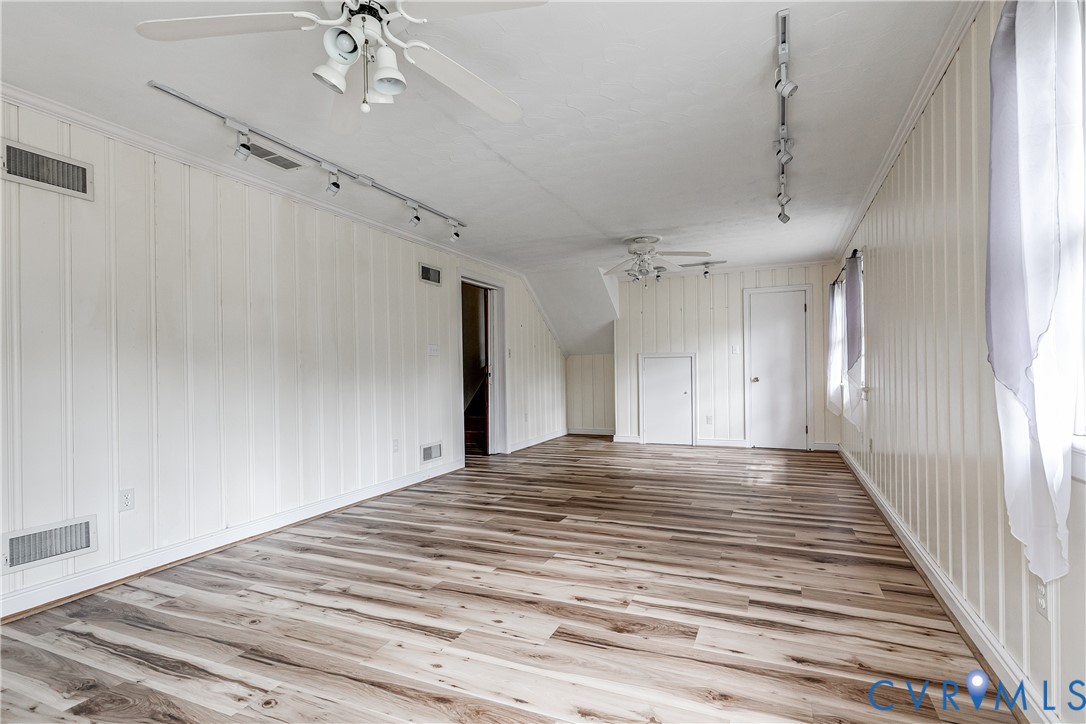 7402 Three Chopt Road Richmond, VA 23226 - Photo 21 of 25 Lower Level Family Room with vinyl plank flooring