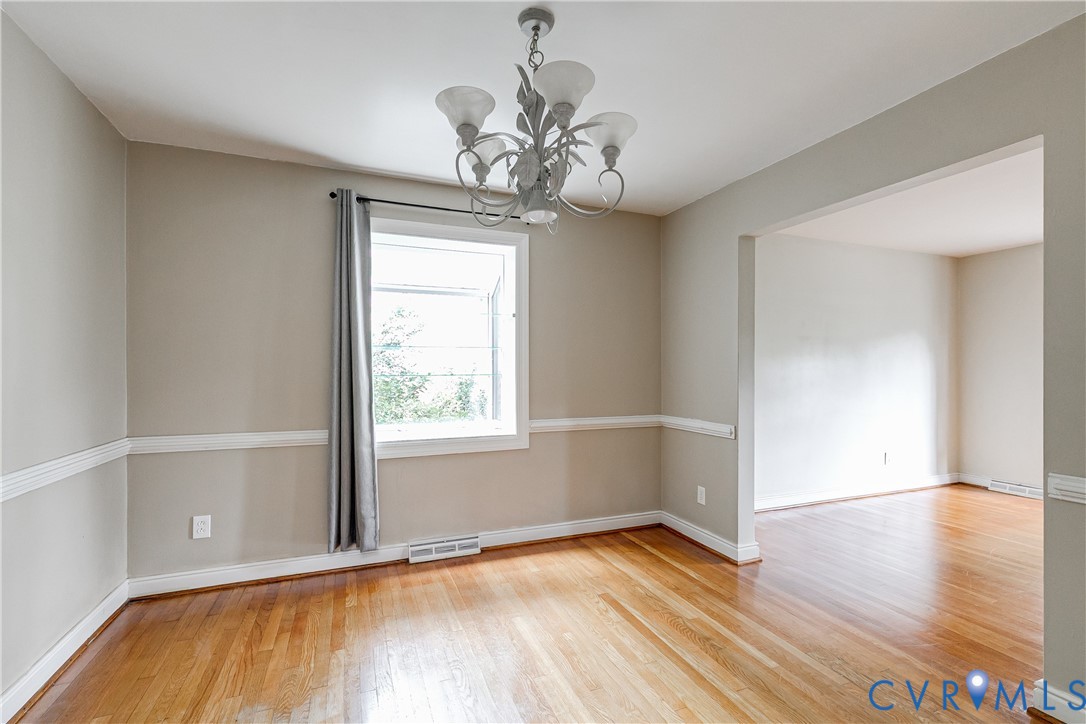 7402 Three Chopt Road Richmond, VA 23226 - Photo 7 of 25 Dining Room with chair rail moulding and greenhous