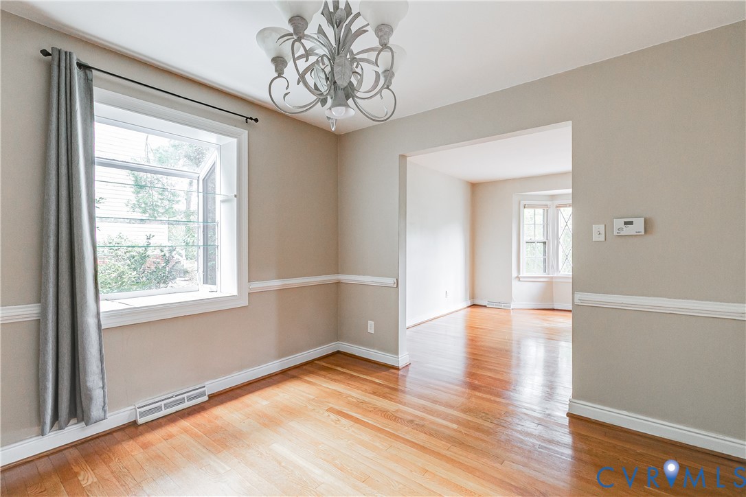 7402 Three Chopt Road Richmond, VA 23226 - Photo 8 of 25 Dining Room with Chair Rail and Greenhouse window