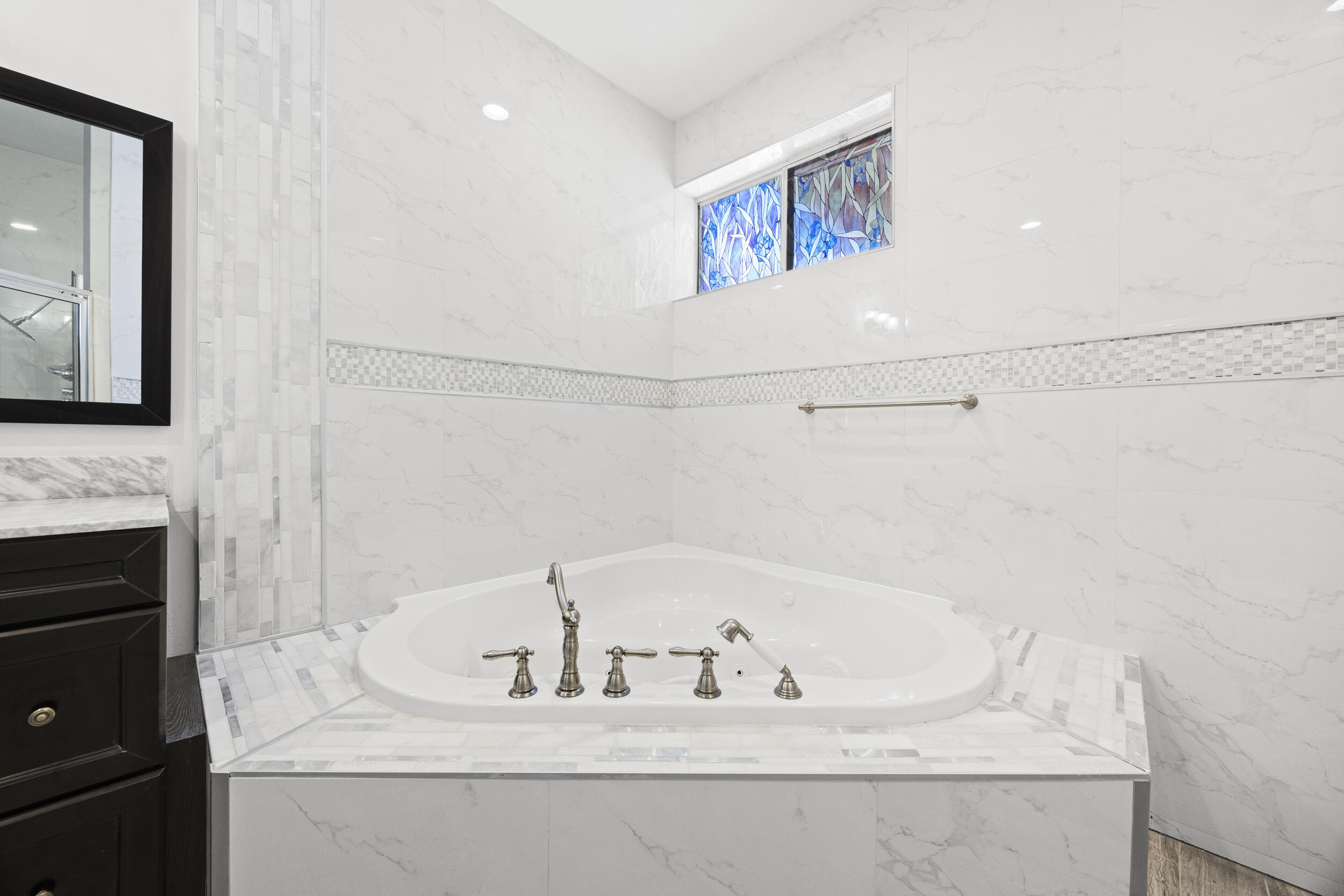 17192 Newport Club Drive Boca Raton, FL 33496 - Photo 30 of 72 a bathroom with a bathtub and a sink