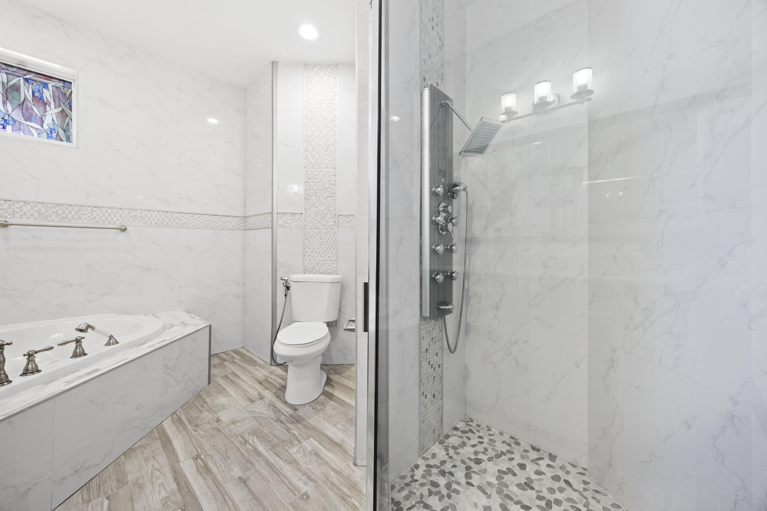 17192 Newport Club Drive Boca Raton, FL 33496 - Photo 31 of 72 a bathroom with a sink a toilet and shower
