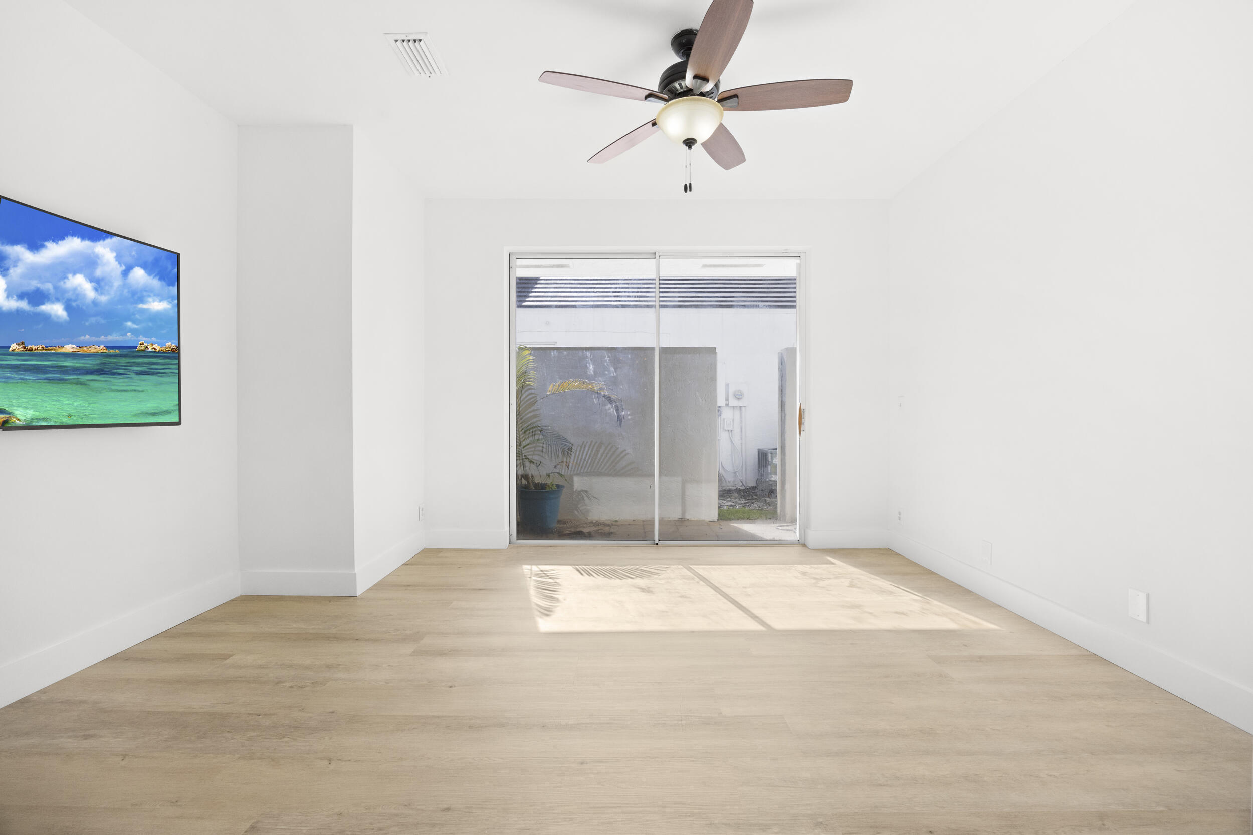 17192 Newport Club Drive Boca Raton, FL 33496 - Photo 34 of 72 a view of an empty room with a fan