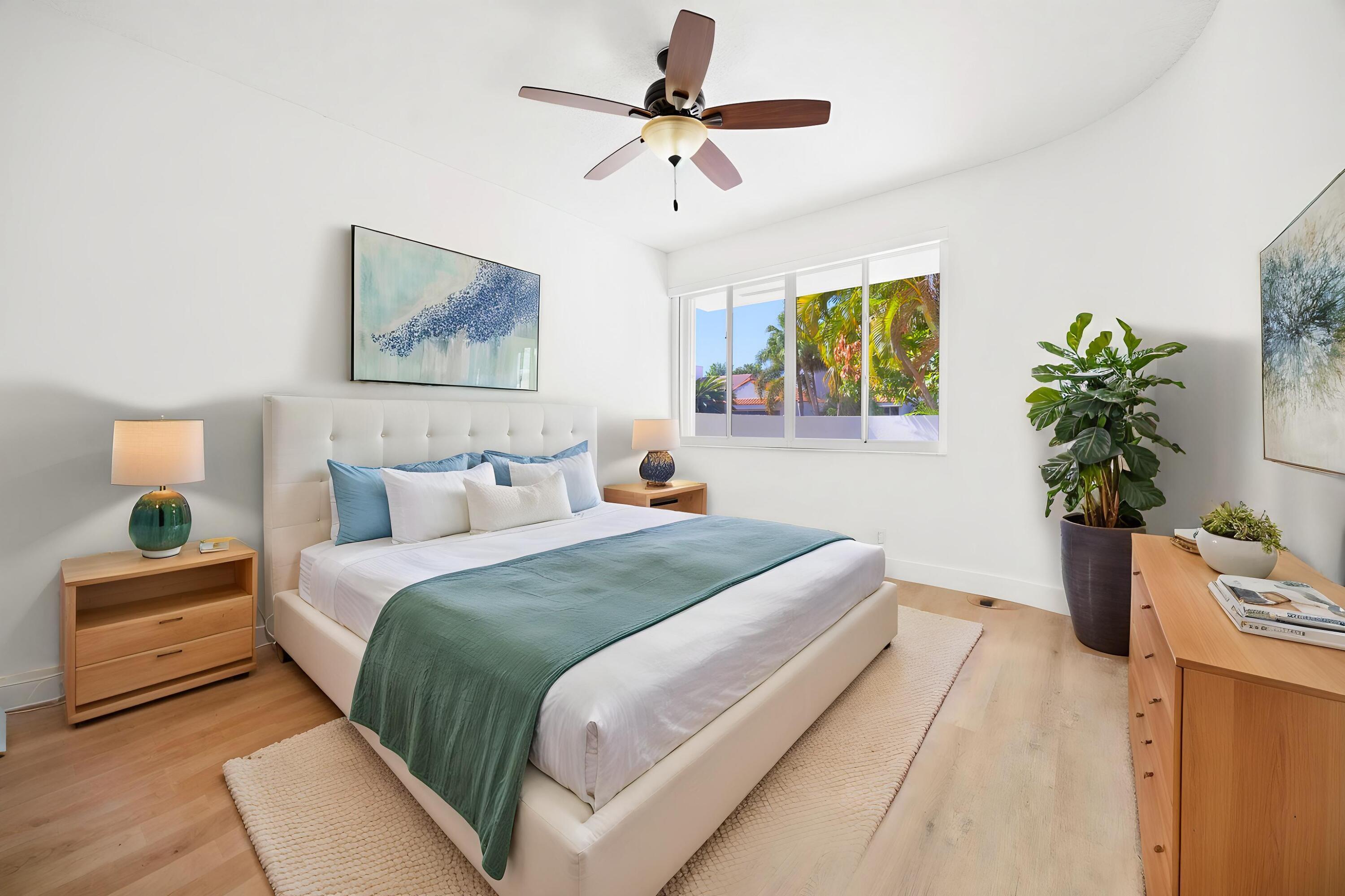 17192 Newport Club Drive Boca Raton, FL 33496 - Photo 37 of 72 a bedroom with a bed and a potted plant