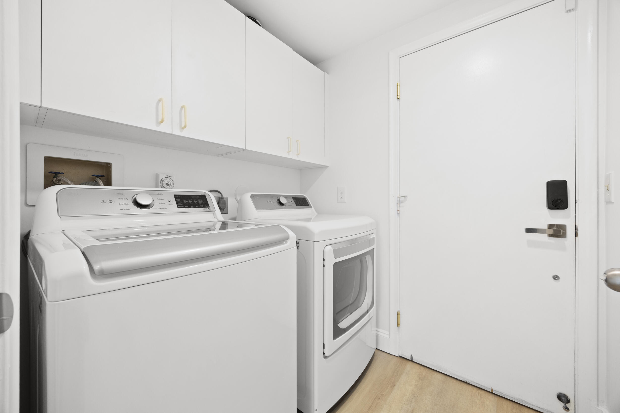 17192 Newport Club Drive Boca Raton, FL 33496 - Photo 43 of 72 a utility room with dryer and washer