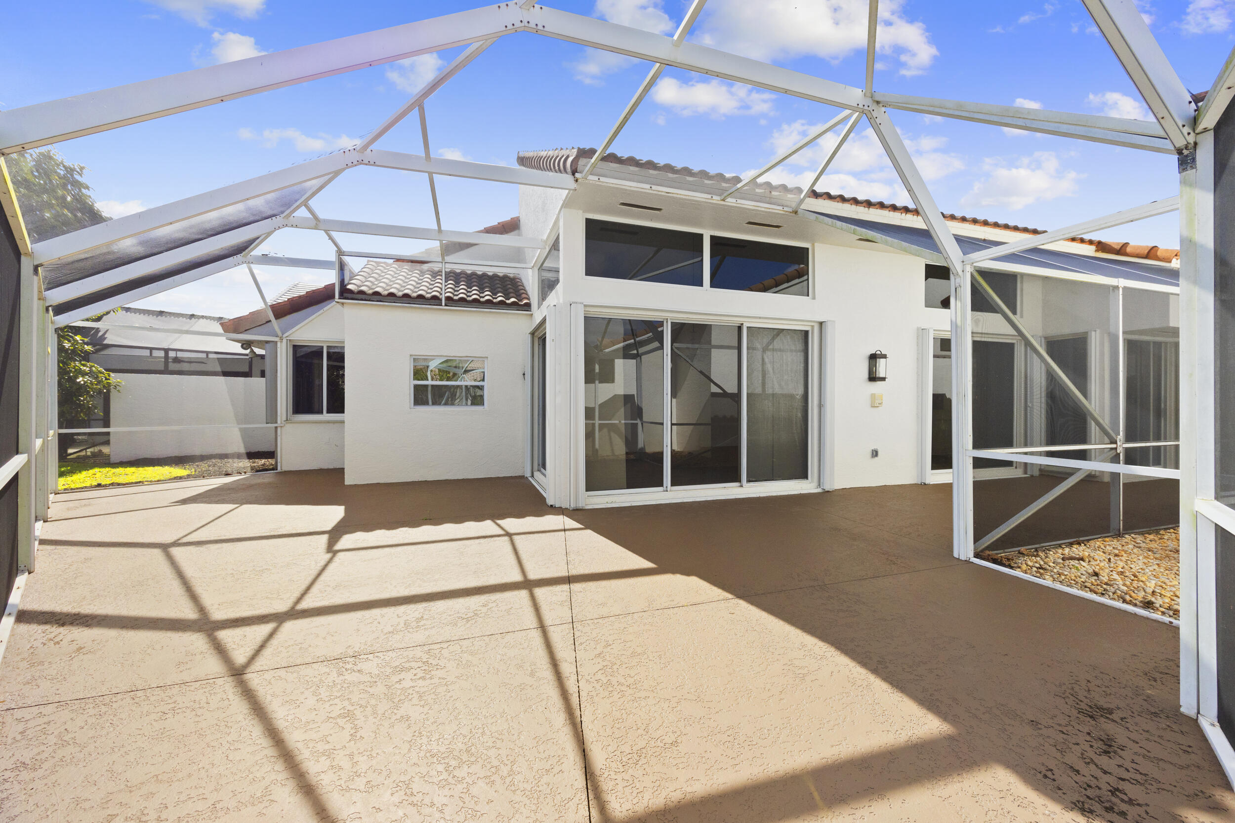 17192 Newport Club Drive Boca Raton, FL 33496 - Photo 45 of 72 a view of a white building with a large window