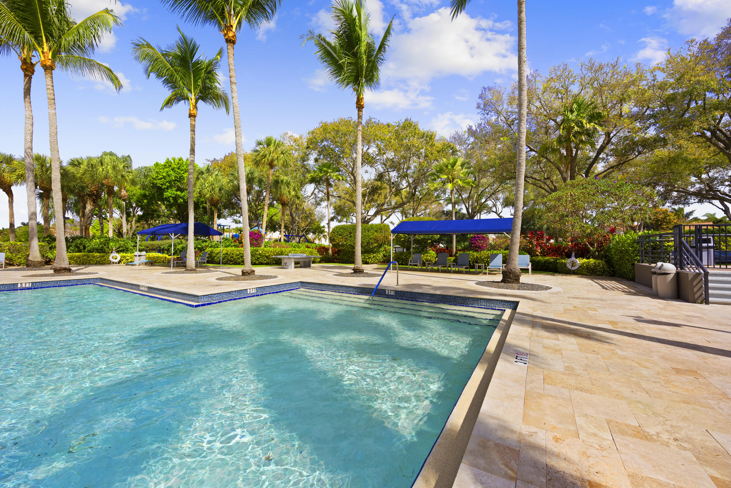 17192 Newport Club Drive Boca Raton, FL 33496 - Photo 57 of 72 a view of a building with a big yard and palm trees