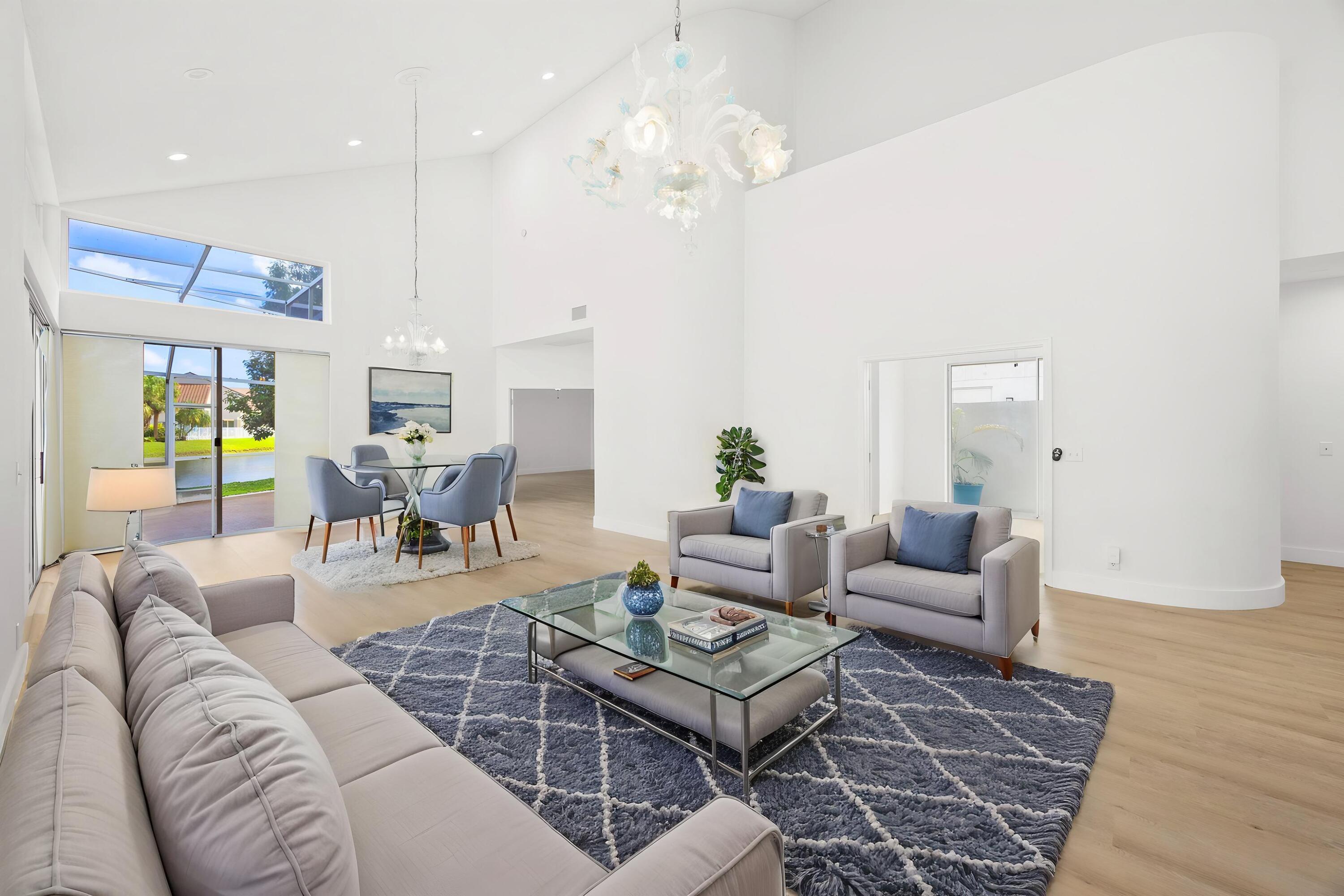 17192 Newport Club Drive Boca Raton, FL 33496 - Photo 6 of 72 a living room with furniture dining area and a chandelier