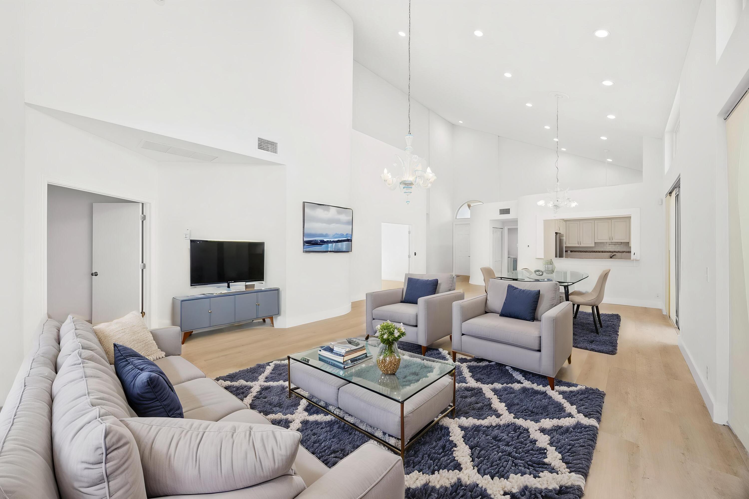 17192 Newport Club Drive Boca Raton, FL 33496 - Photo 8 of 72 a living room with furniture a rug and a flat screen tv