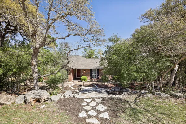 a front view of a house with yard porch and furniture