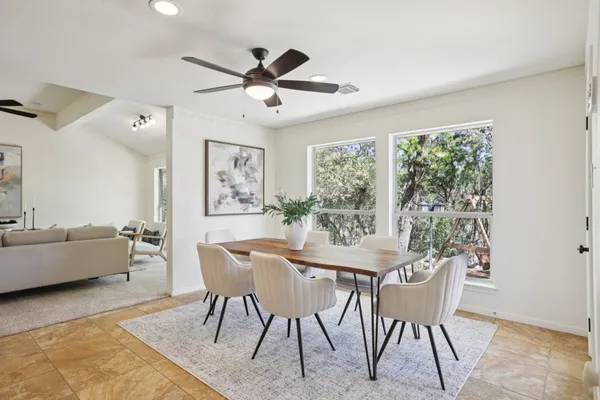 a view of a dining room with furniture window and wooden floor