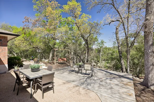 a view of a backyard with sitting area