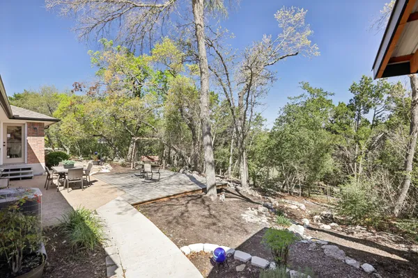 a view of a backyard with sitting area