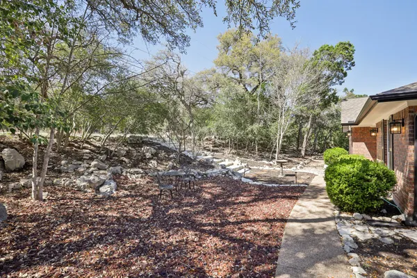 a backyard of a house with lots of green space