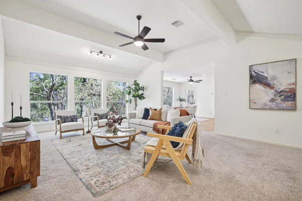 a living room with furniture and a large window