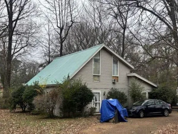 a view of two chairs and a table in the house