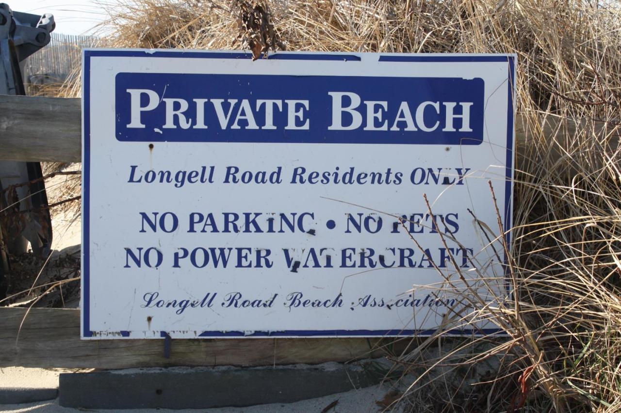 30 Longell Road Dennis Port, MA 02639 - Photo 1 of 19 a sign on the side of a building