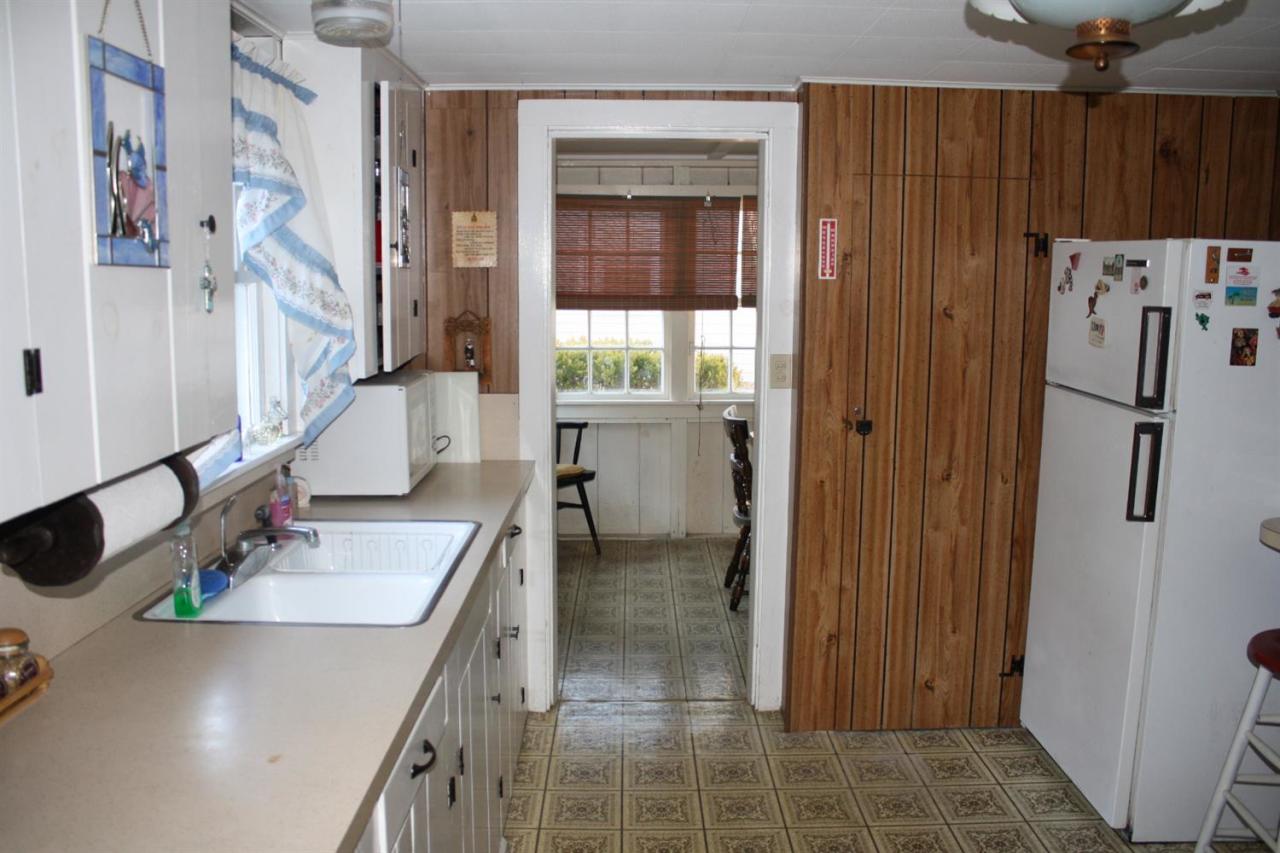 30 Longell Road Dennis Port, MA 02639 - Photo 11 of 19 a bathroom with a sink a mirror and shower