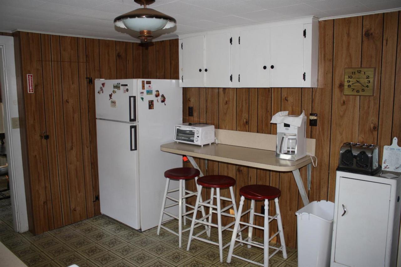 30 Longell Road Dennis Port, MA 02639 - Photo 13 of 19 a kitchen with stainless steel appliances a refrigerator and a stove