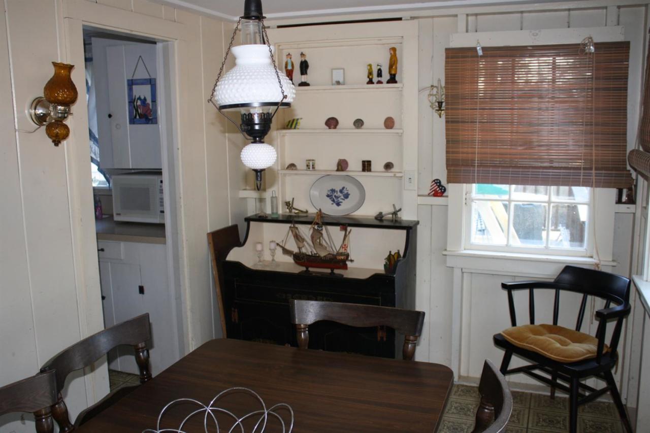 30 Longell Road Dennis Port, MA 02639 - Photo 15 of 19 a view of a dining room with furniture and window