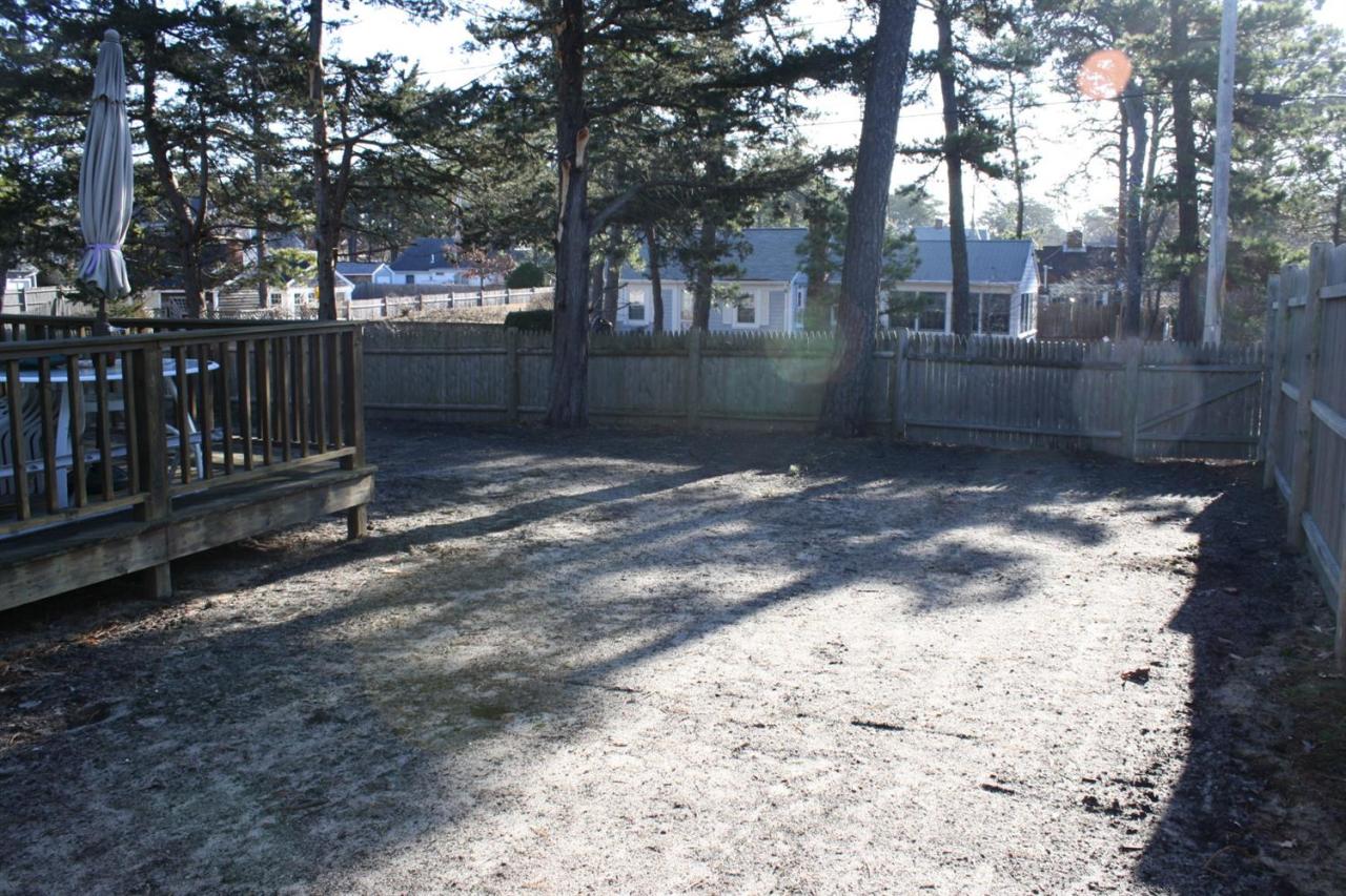 30 Longell Road Dennis Port, MA 02639 - Photo 3 of 19 a backyard of a house with lots of green space