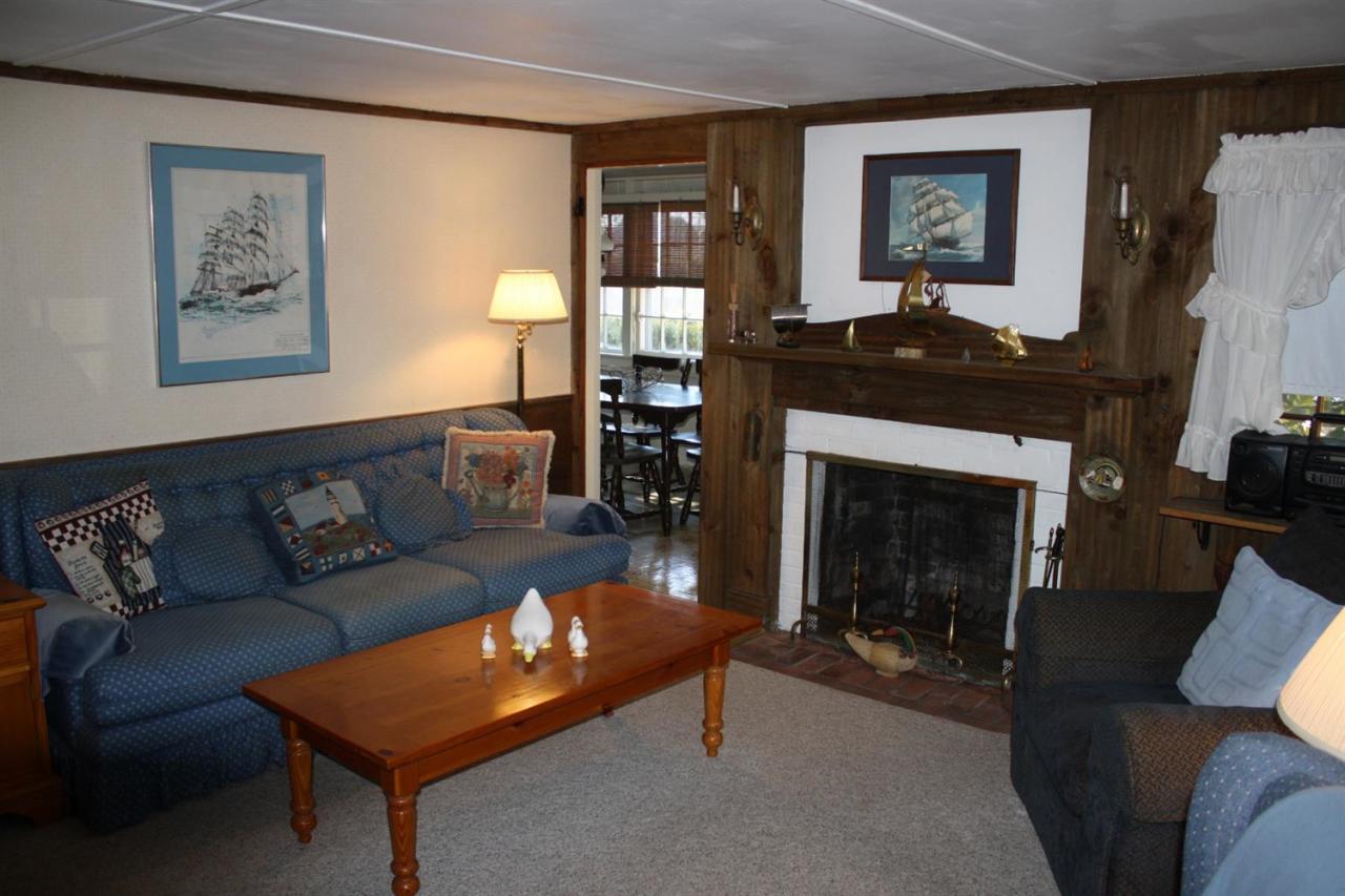 30 Longell Road Dennis Port, MA 02639 - Photo 5 of 19 a living room with furniture and a fireplace