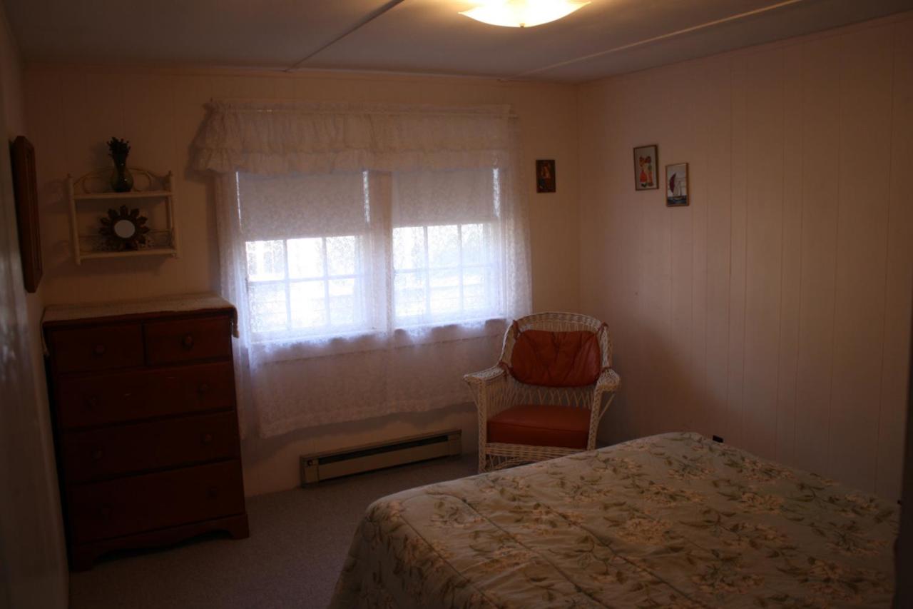 30 Longell Road Dennis Port, MA 02639 - Photo 7 of 19 a bedroom with a bed and a window