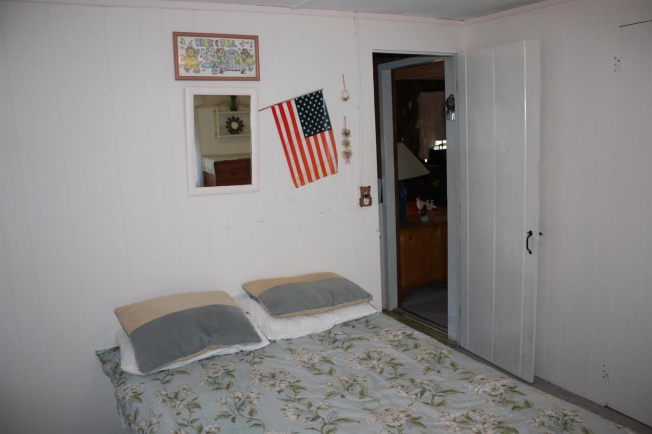 30 Longell Road Dennis Port, MA 02639 - Photo 8 of 19 a bedroom with a bed and a desk