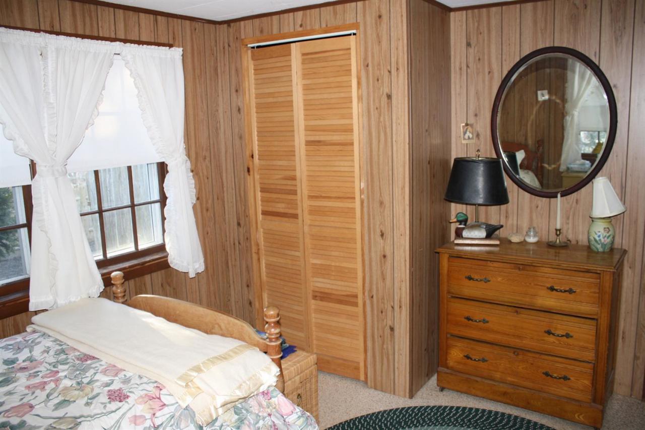 30 Longell Road Dennis Port, MA 02639 - Photo 10 of 19 a bedroom with a bed and a mirror