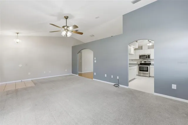 a kitchen with stainless steel appliances granite countertop a sink and cabinets